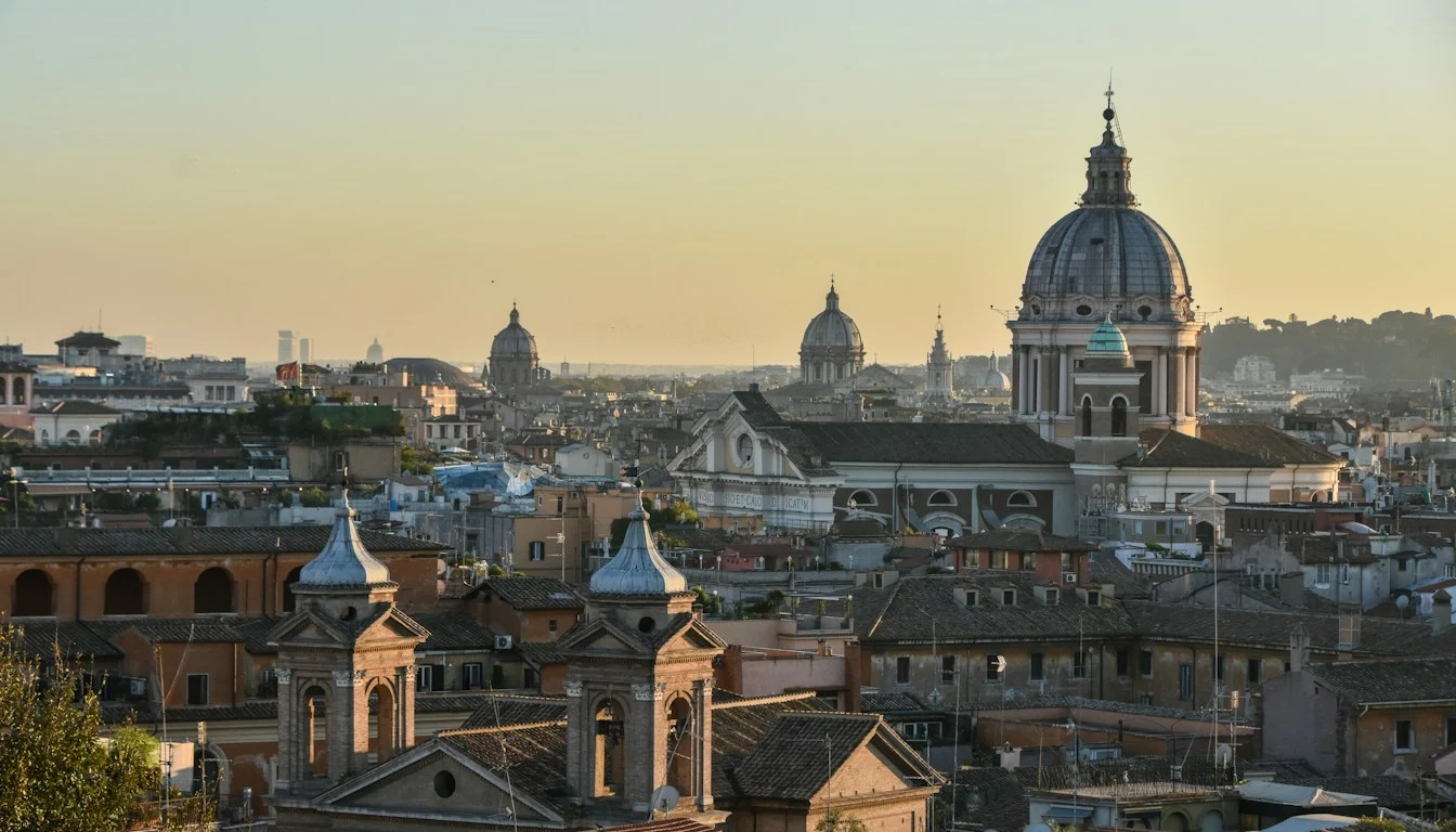Rome rooftops and domes in warm evening light